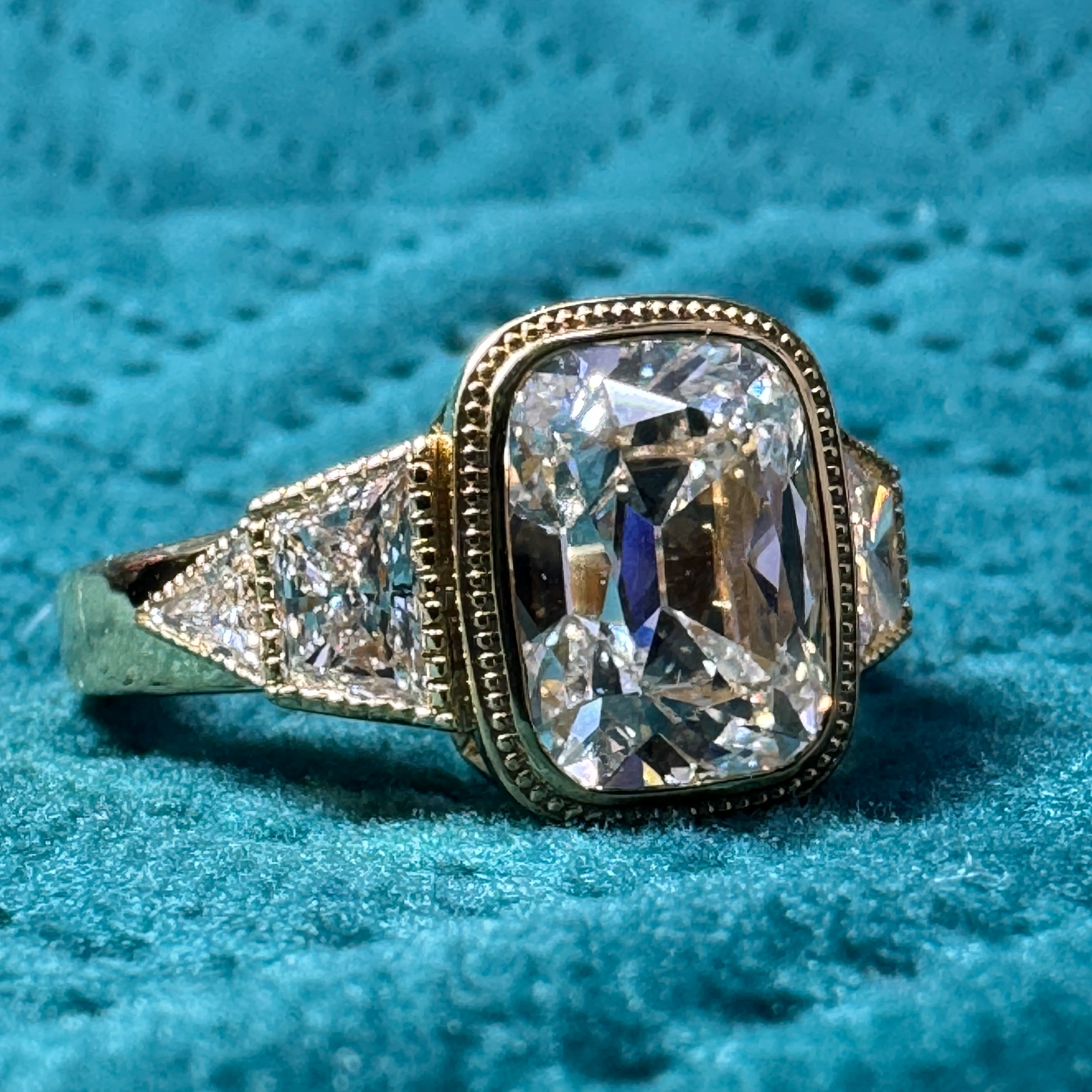 Elegant 5.74 CT Cushion Cut Diamond Ring in 18 KT Yellow Gold with Triangle & Trapezoid Accents