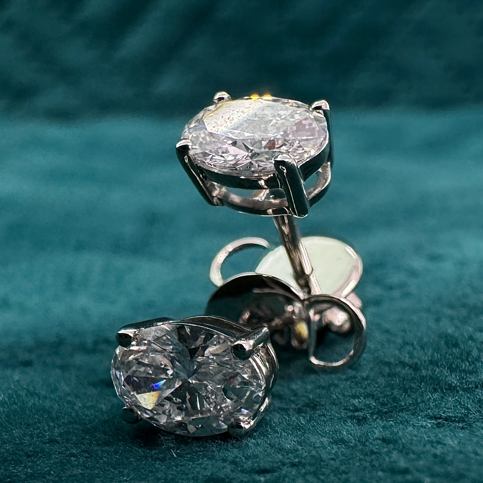 Exquisite 3.00 CT Total Lab Grown Diamond Earrings featuring Pear & Round Brilliant cuts for exceptional sparkle and elegance view 3