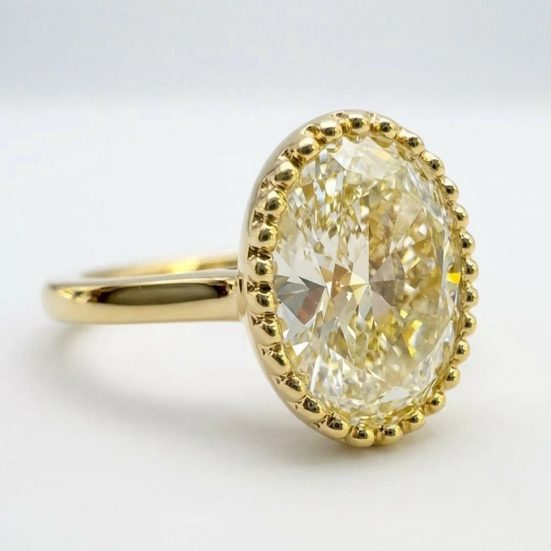 Oval Cut Lab Grown Diamond Milgrain Bezel Ring in Yellow Gold view 5